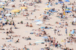 Very crowded beach full of people in Tossa de Mar