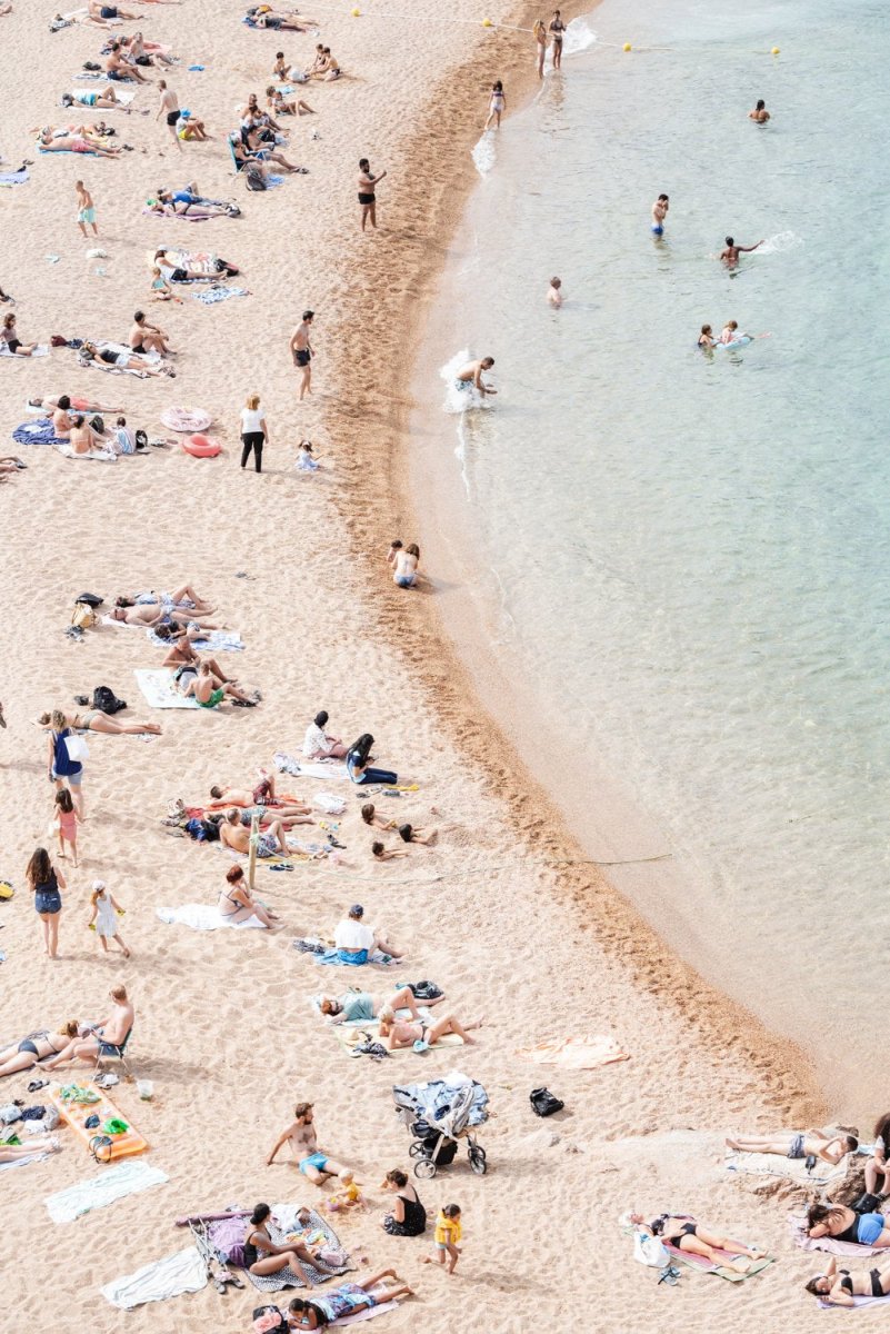 Light colors of people swimming at Tossa de Mar beach