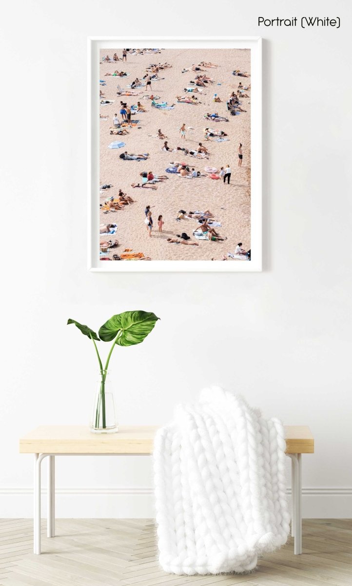 Lots of people lying on the sand in Tossa de Mar in a white fine art frame