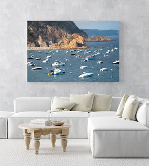 Many boats anchored off in ocean along Tossa de Mar beach in Spain in an acrylic/perspex frame