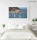 Many boats anchored off in ocean along Tossa de Mar beach in Spain in a white fine art frame