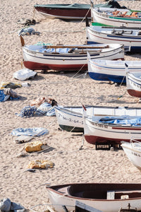 Wooden boats beached on the sand