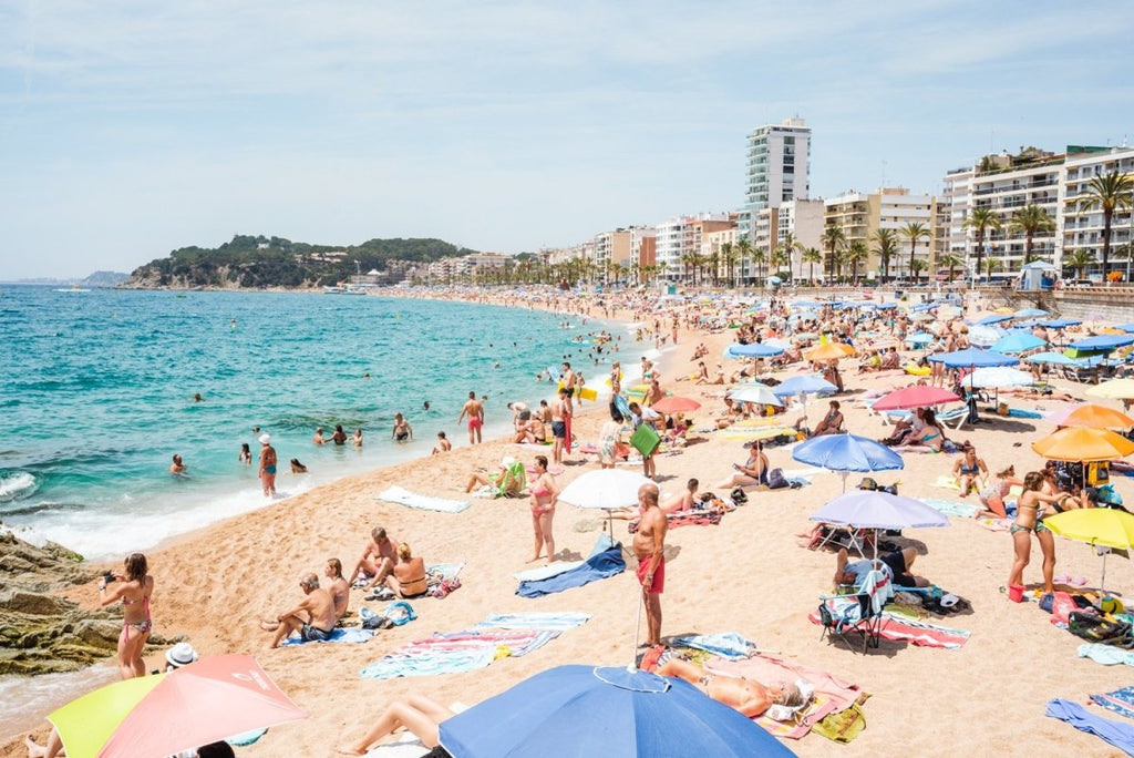 Very busy Lloret de Mar beach on summers day in June