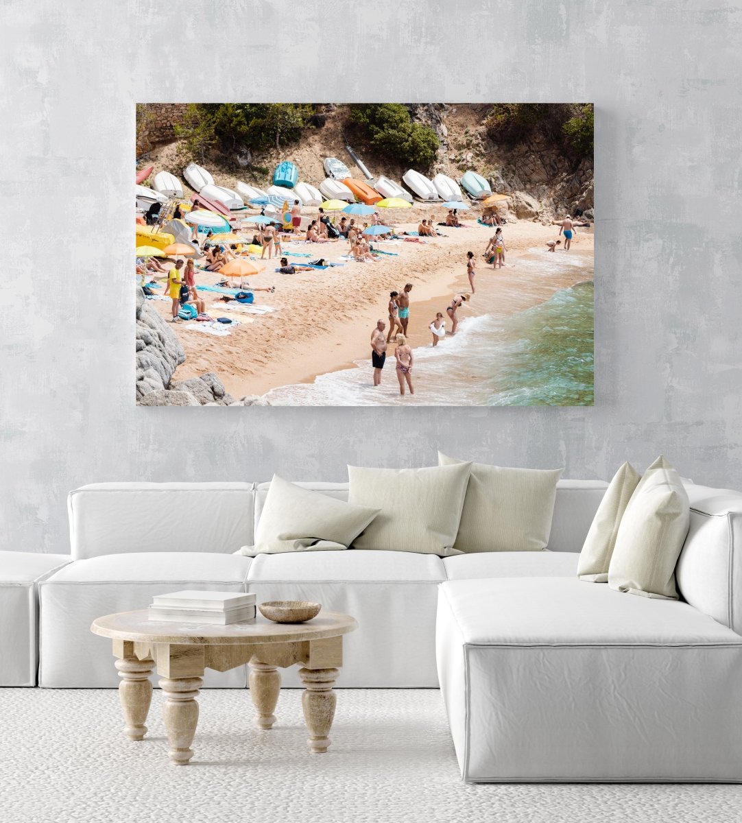 Colorful boats, umbrellas and people lying on beach in an acrylic/perspex frame