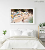 Colorful boats, umbrellas and people lying on beach in a white fine art frame
