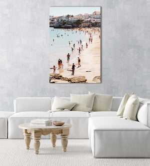 Lots of people along the water and beach in Cascais in an acrylic/perspex frame
