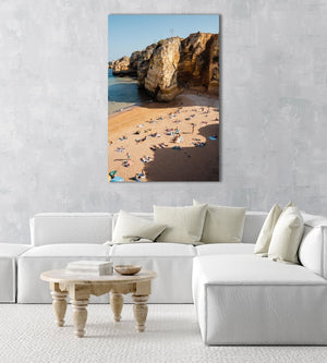 Shadows, cliffs and people on Praia Dona Ana in Lagos from above in an acrylic/perspex frame