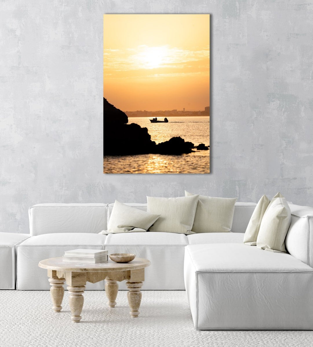 Orange sunrise with a boat cruising past Lagos coastline in an acrylic/perspex frame