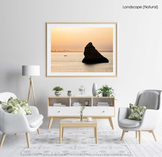 Large boulder and a fishing boat during Lagos sunrise in a natural fine art frame