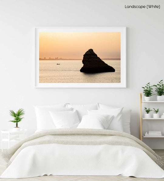 Large boulder and a fishing boat during Lagos sunrise in a white fine art frame