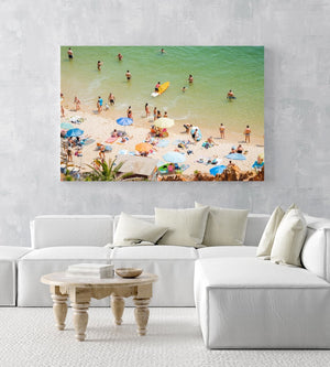 Colorful boards, people, water and sand on Praia do Camilo Lagos in an acrylic/perspex frame
