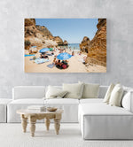 Blue umbrellas and people on Camilo beach Portugal in an acrylic/perspex frame