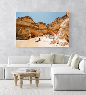 High cliffs overhanging beach where people lying under in June in an acrylic/perspex frame