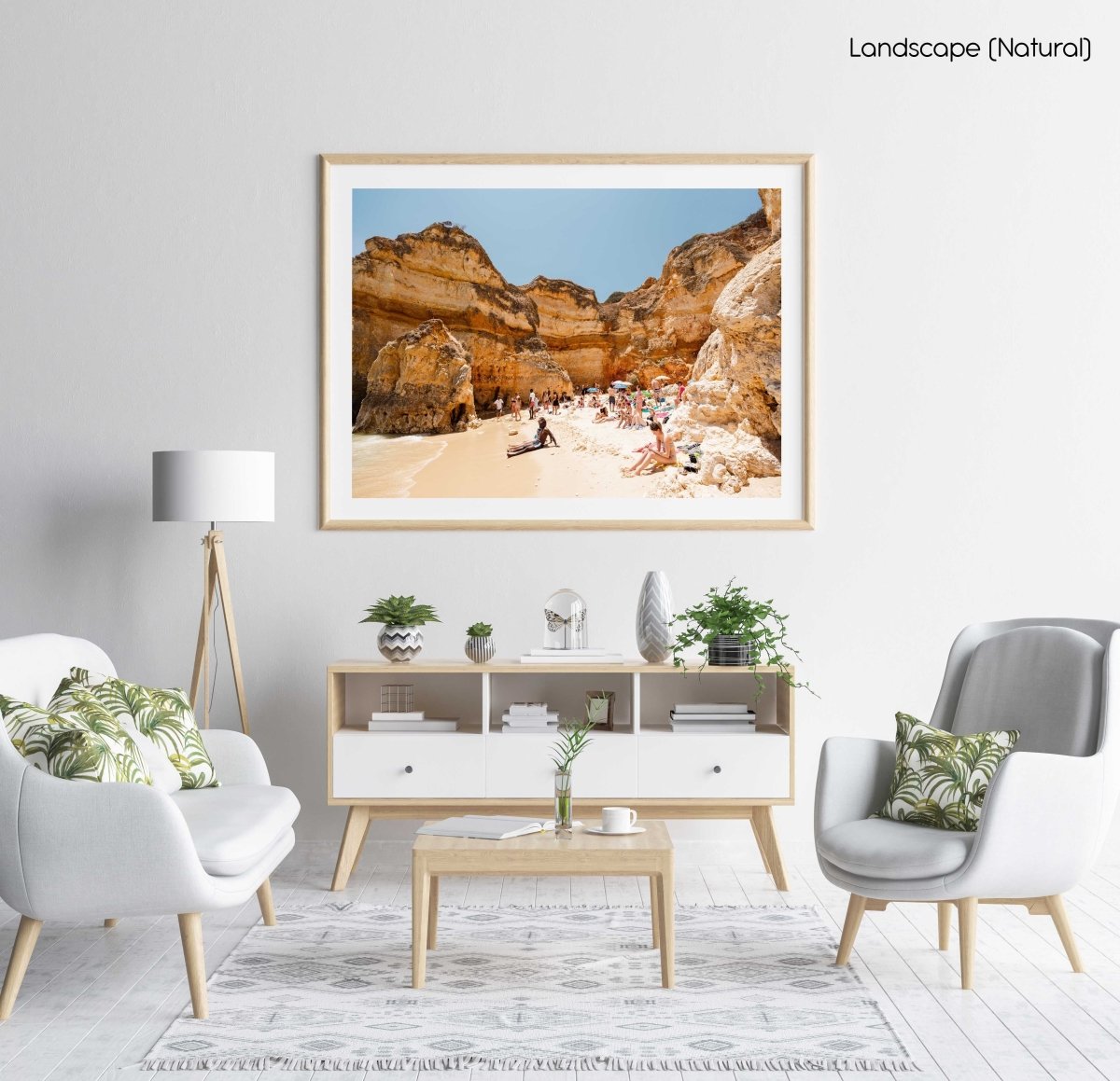 High cliffs overhanging beach where people lying under in June in a natural fine art frame