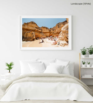 High cliffs overhanging beach where people lying under in June in a white fine art frame