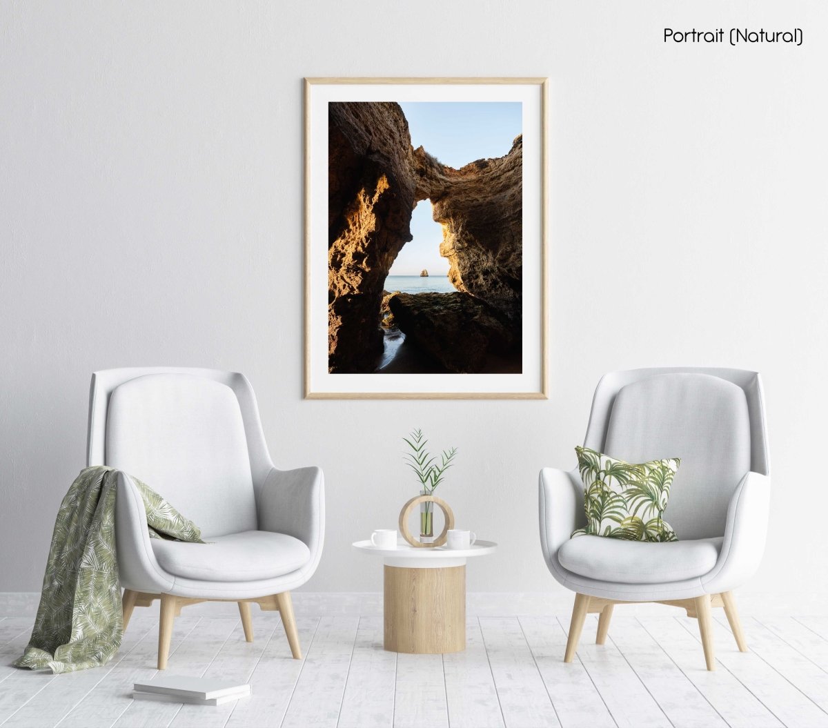 Inside a cave in Lagos looking out to blue sea and rock in a natural fine art frame