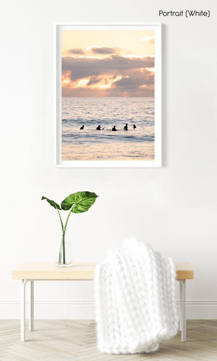 Five Surfers waiting for a wave during sunset