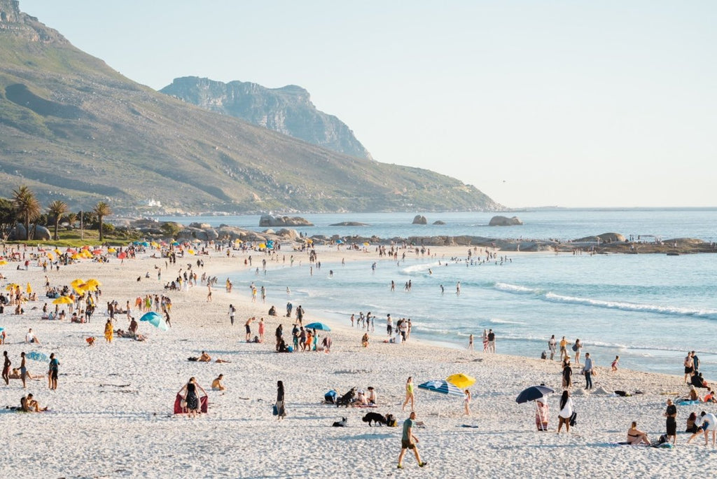 Camps Bay Beach filled with lots of people on a hot day