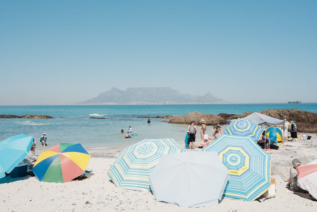 People enjoying sun with Table Mountain in backdrop
