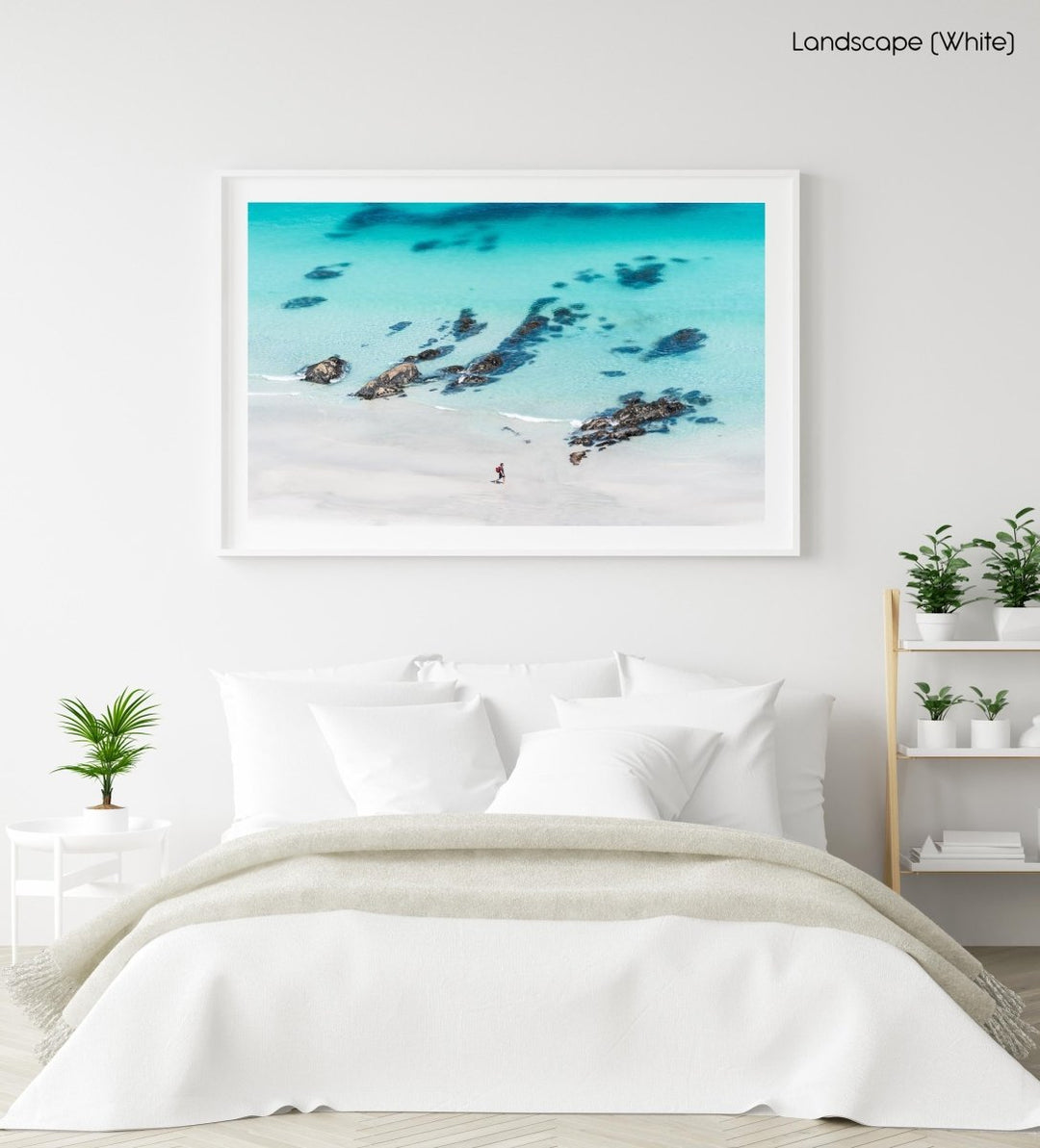 Person walking along crystal clear blue water at beach wall art