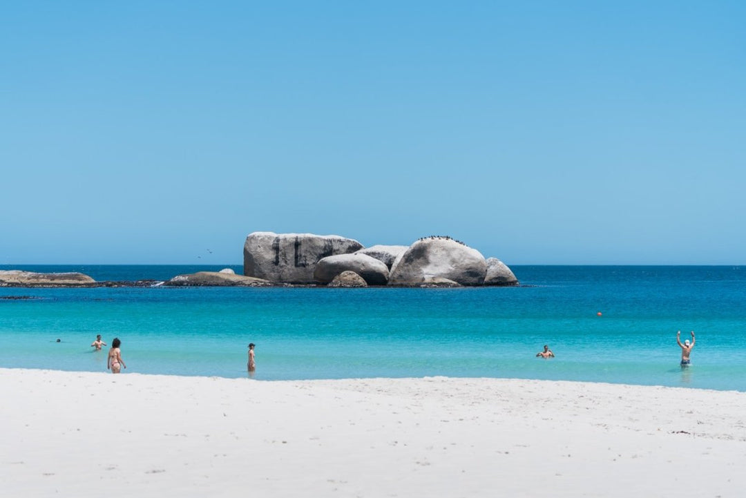 Peoeple walking and swimming on Clifton fourth beach photography