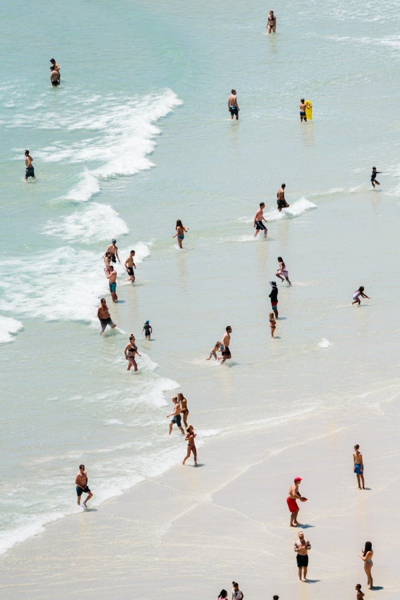 Blue ocean and people playing in waves artwork