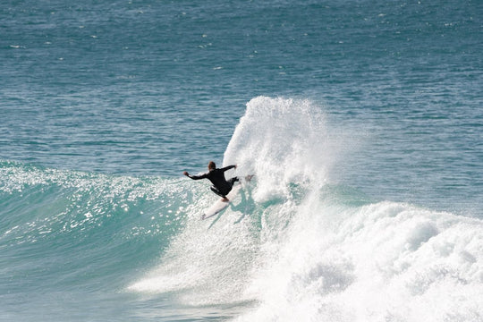 Surfer carving at Jeffrey's Bay