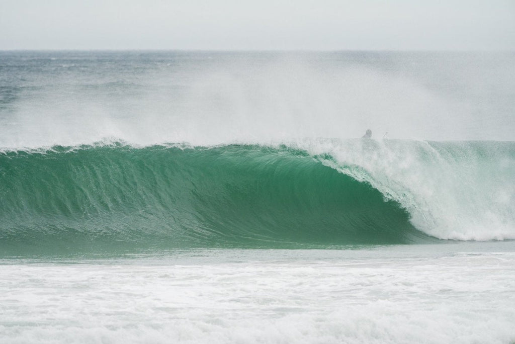 Green barrel of a wave at Llandudno beach