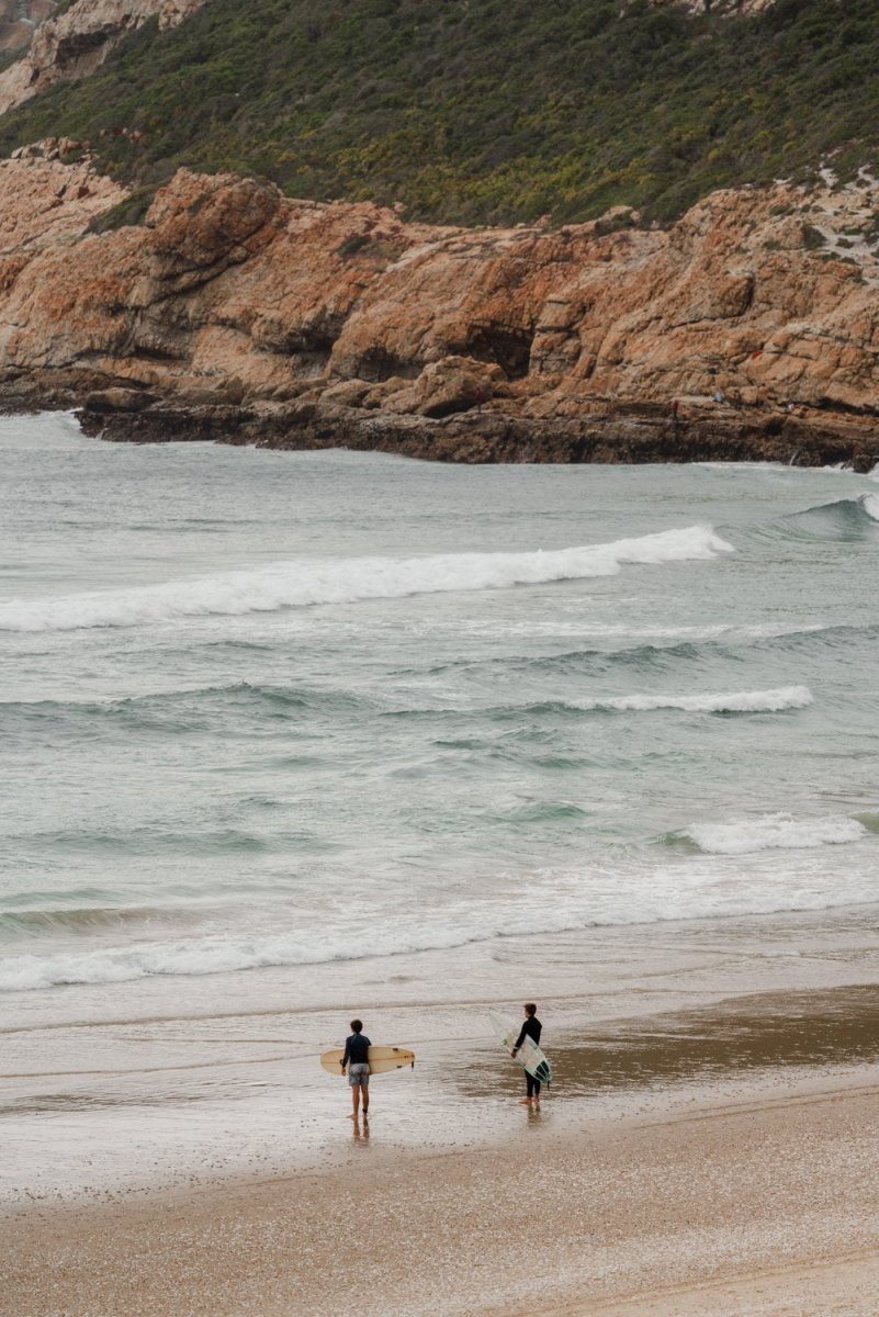 Two surfers on Robberg Beach Plett