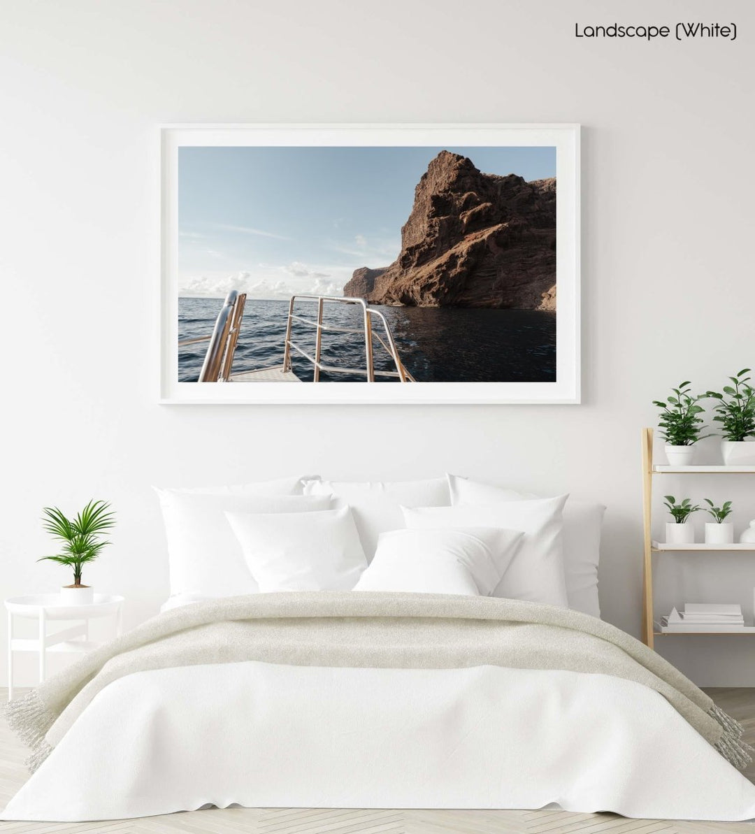 Sunset on a boat overlooking the ocean and mountain with a ladder.