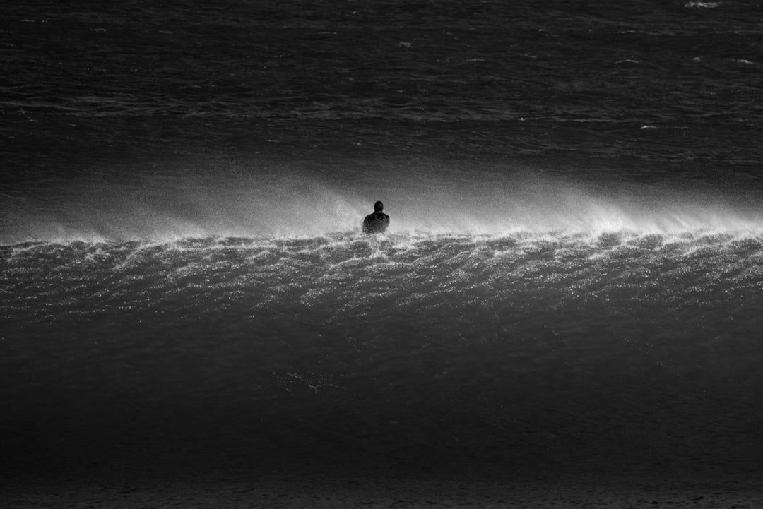 Surfer on a wave, along the West Coast of South Africa