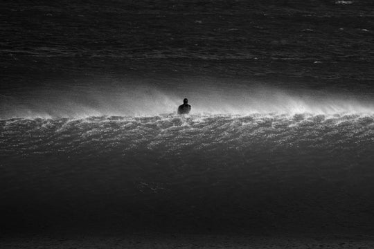 Surfer on a wave, along the West Coast of South Africa