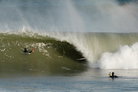 Surfer in a barrel on west coast beach in south africa