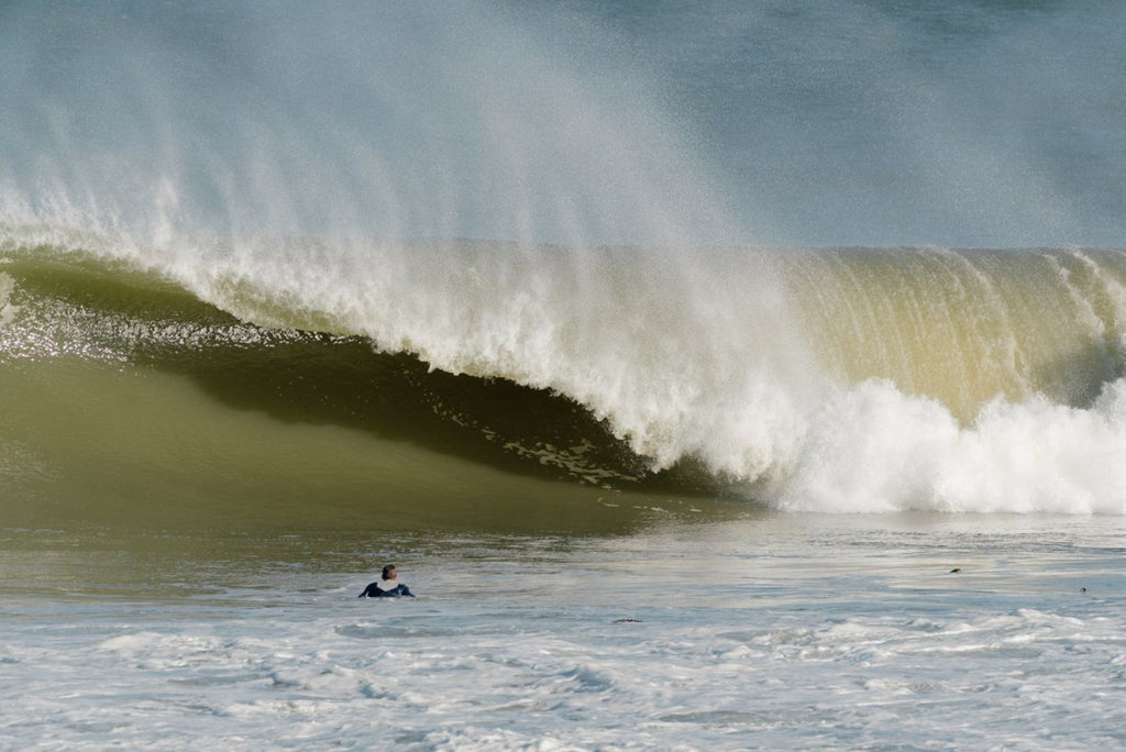 Surfer in a barrel on west coast beach in south africa