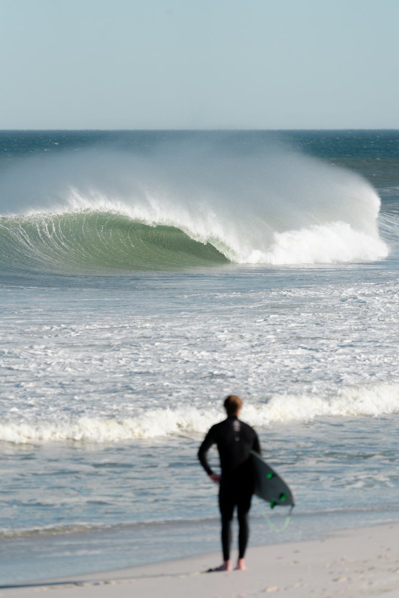 Surfer in a barrel on west coast beach in south africa