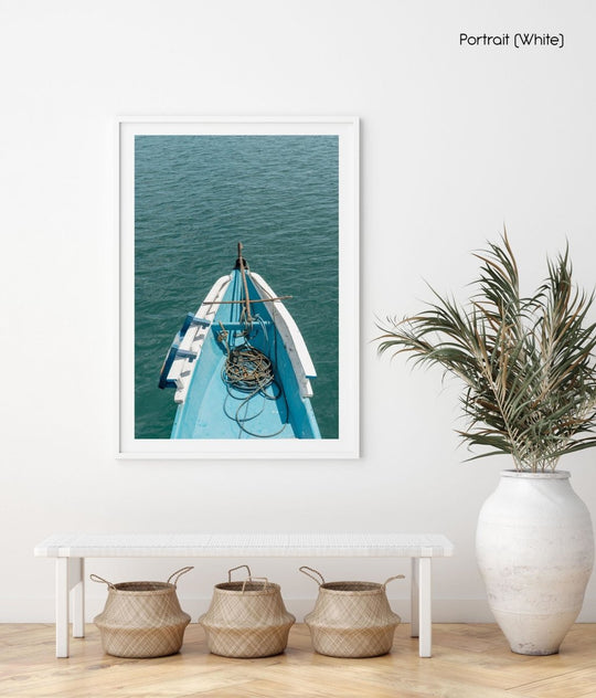 Blue boat moving across water in Bali, Indonesia on Lombok island.