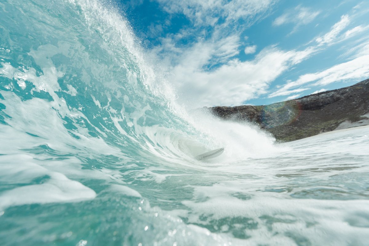 In the water image of barreling wave on dias beach in cape point, south africa.